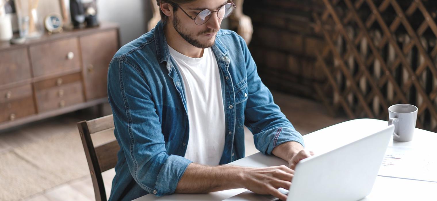 Person working with financial documents and calculator